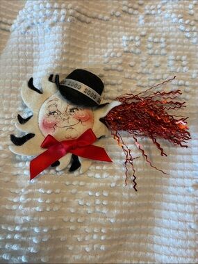 Vintage Annalee New Year’s Black and White Felt Sun Face Pin with Red Streamers